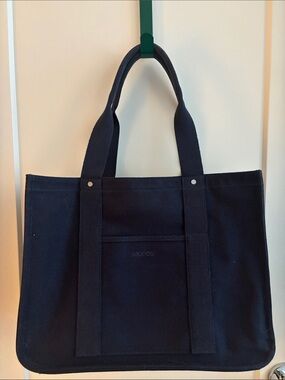MONOS Gesso Tote Navy Canvas Tote Bag With Latch Closure and Luggage Strap